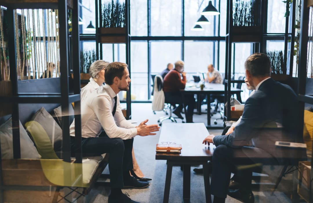 Businesspeople discussing strategy on couch